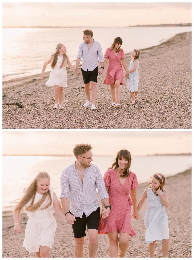 Golden Hour Family Shoot in Hampshire - Golden hour family photography in Hampshire at Meon Shore beach. A blended family of four walk hand in hand along the shoreline, smiling and laughing together, with the sun reflecting on the water behind them